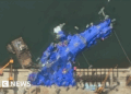 North Korea detains three officers over warship launch accident, state media says