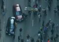 Automobile drives by means of anti-ICE protesters in Chicago as demonstrations develop