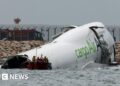 Emirates cargo airplane skids off runway into sea at Hong Kong Worldwide Airport Emirates cargo airplane skids off runway into sea at Hong Kong Worldwide Airport