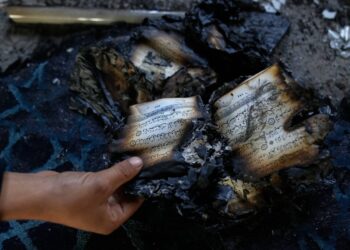 Israeli settlers torch a mosque and scrawl hateful messages after condemnation from navy leaders