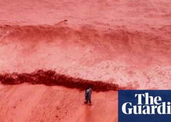Rainfall creates crimson spectacle at seashore on Iran’s Hormuz Island | Iran