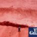 Rainfall creates crimson spectacle at seashore on Iran’s Hormuz Island | Iran