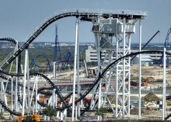 Texas curler coaster malfunction traps 2 riders greater than 100 toes within the air
