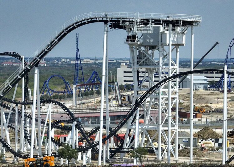 Texas curler coaster malfunction traps 2 riders greater than 100 toes within the air