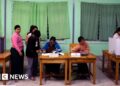 Battle-torn Myanmar voting in broadly criticised ‘sham’ election