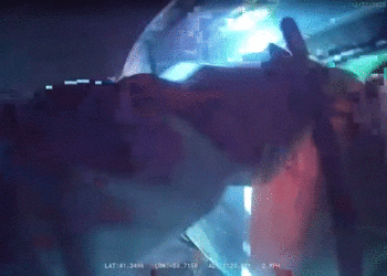 Ohio officers drag injured driver from burning automobile after rollover