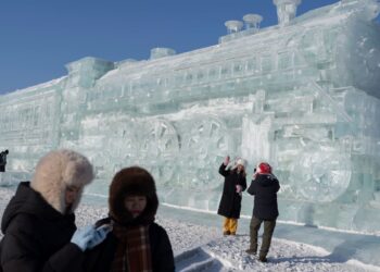 Photographs present Harbin ice pageant in northern China