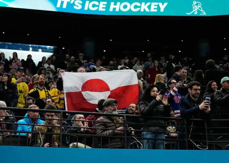 Followers elevate Greenland’s flag to protest US Olympic hockey win over Denmark