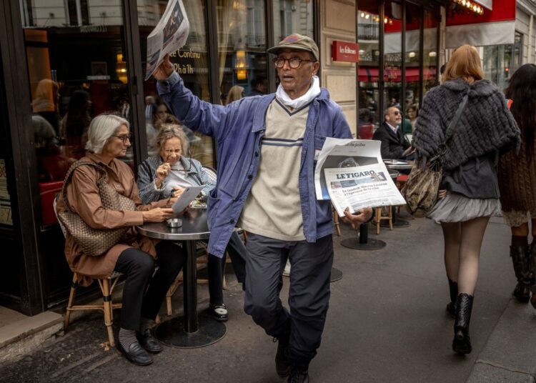France honors final newspaper hawker in Paris with knighthood : NPR