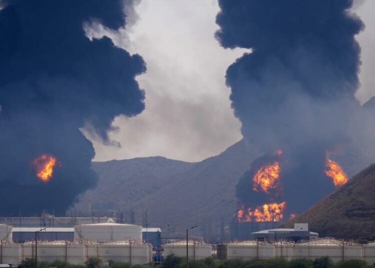 Photographs: Hearth at Key UAE Oil Hub Day After US Assault on Iran Oil Depot