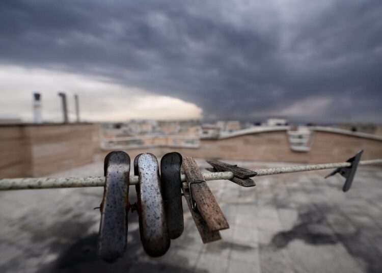 Black clouds over Tehran rain down oil drops after Israel strikes oil services