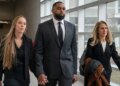 Sherrone Moore and spouse maintain arms in Michigan courtroom