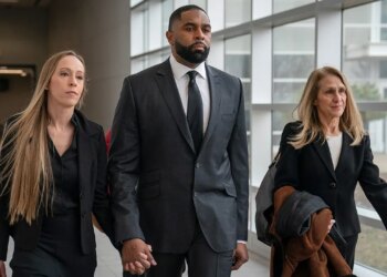 Sherrone Moore and spouse maintain arms in Michigan courtroom