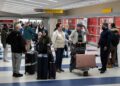 Stranded People within the Center East navigate canceled flights and confusion