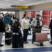 Stranded People within the Center East navigate canceled flights and confusion