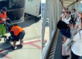 Crowd cheers as airport employees lastly collapse cussed child stroller