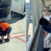 Crowd cheers as airport employees lastly collapse cussed child stroller