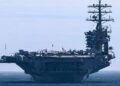 Two US destroyers face ‘sustained’ Iranian assault in Strait of Hormuz